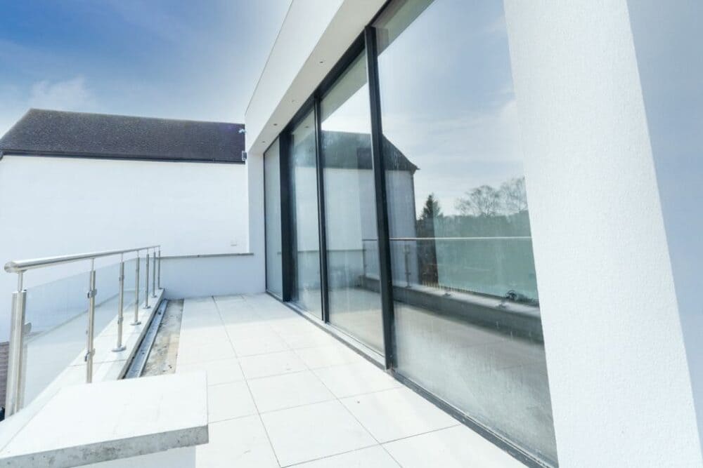 balcony aluminium sliding doors London in a newly built house