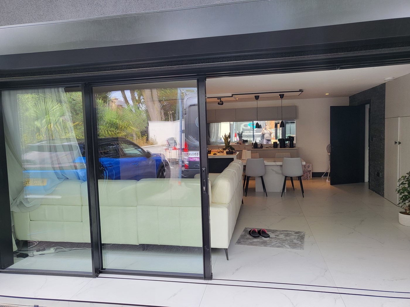 black sliding doors London from the outside leading to luxurious living room