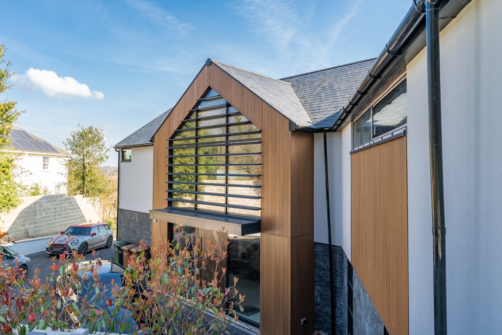 large aluminum windows London in a modern half-wooden house