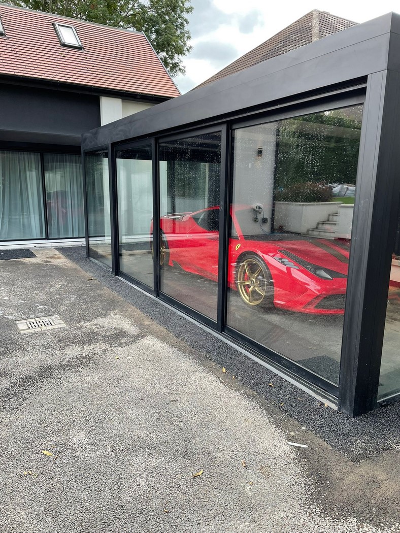 sports car in a glass garage made of aluminum windows