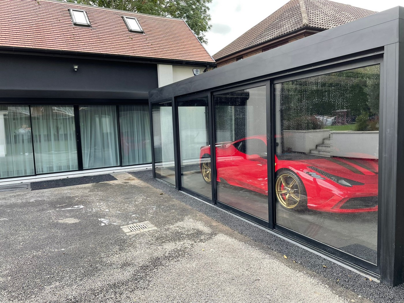 sports car in the garage made of aluminium sliding doors