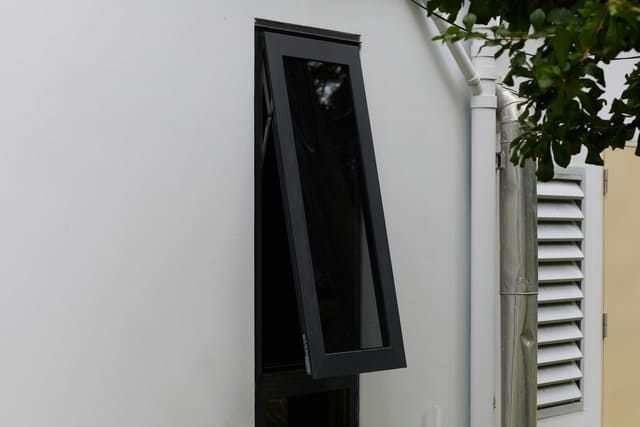 black and modern casement aluminium windows wide open from the outside